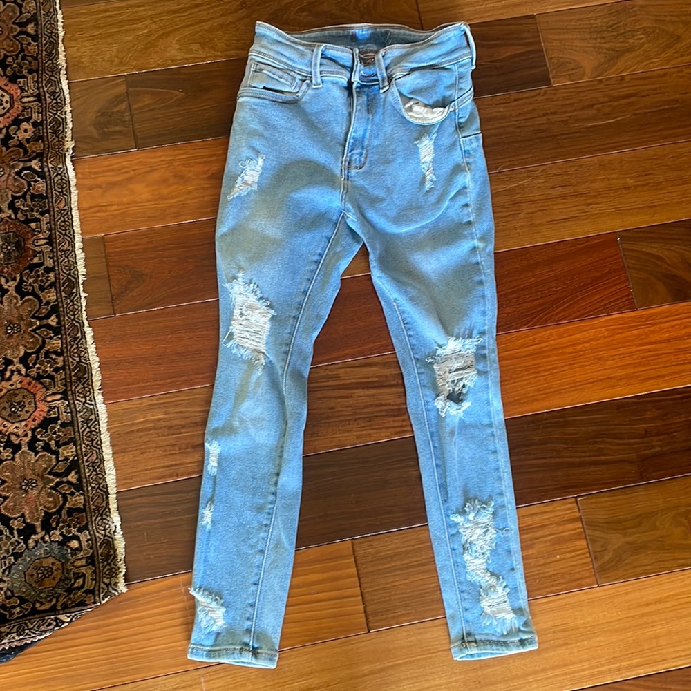 High waisted tight ripped jeans